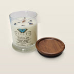 Evolve Botanica Nebula sipper candle open with wood lid and crystals — cedarwood bergamot vanilla mandarin soy candle