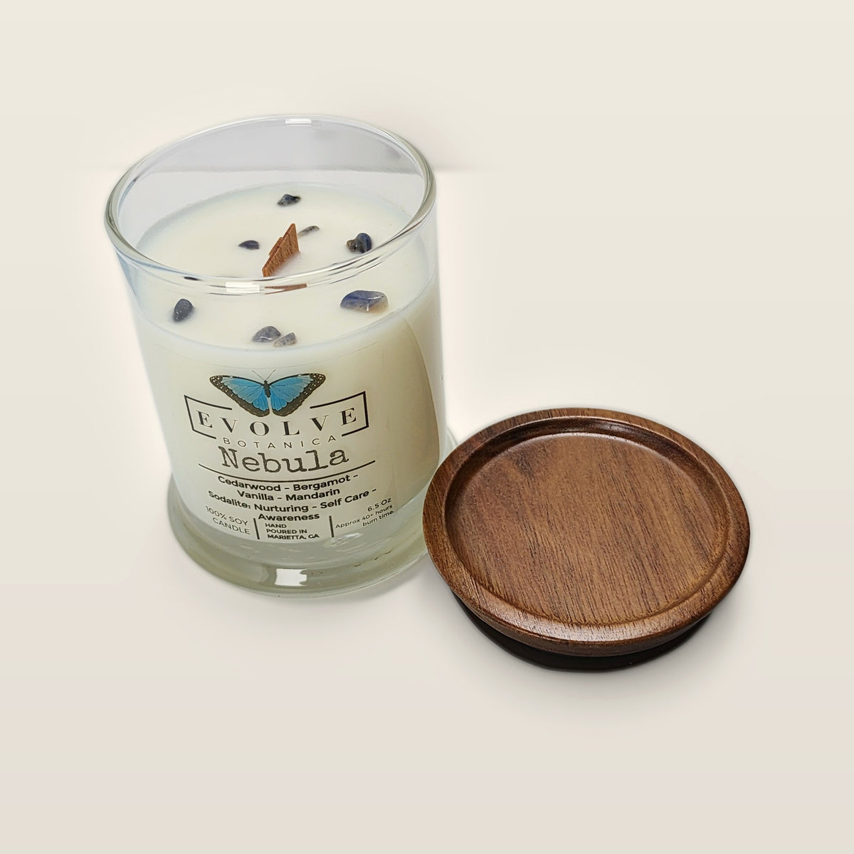 Evolve Botanica Nebula soy sipper candle angled view showing crystals and wood wick