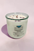 Lavender Love Rocks candle on soft pink — calming lavender wood wick soy candle with amethyst and quartz crystals, Evolve Botanica
