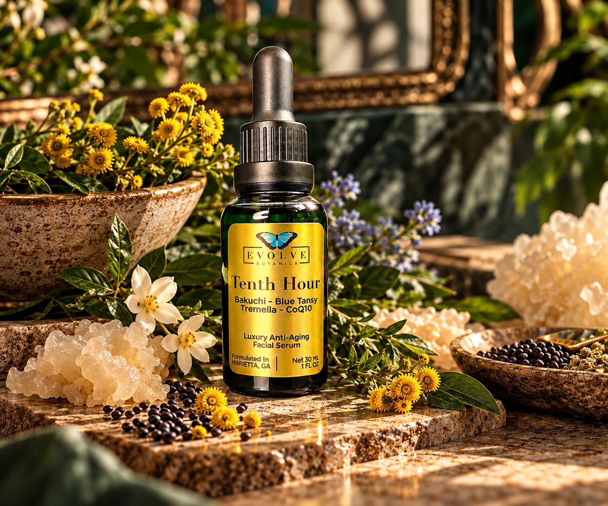 Tenth Hour Blue Tansy facial serum surrounded by bakuchi seeds, Tremella, yellow blooms and jasmine in a botanical garden setting, hand-formulated in Marietta Georgia